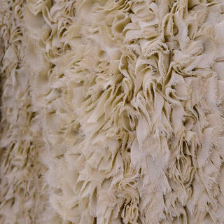 Texture detail of vintage ruffled silk jacket