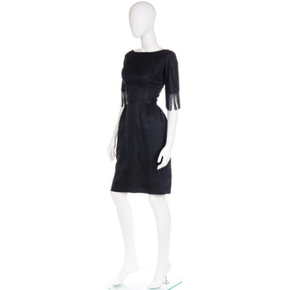 1960s vintage cocktail dress in black with fitted waist and beaded loop fringe