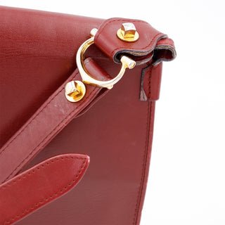 1970s Le Must de Cartier Vintage Bordeaux Leather Shoulder Bag with gold hardware and cc logo 