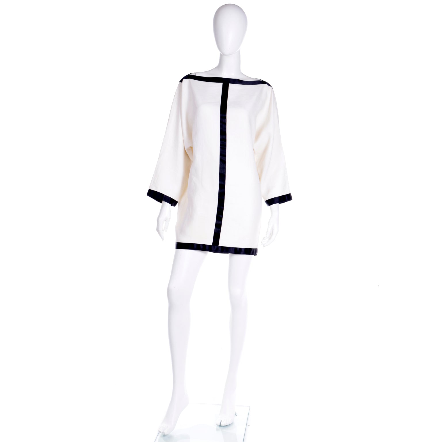 white linen dress with black trim The little white dress. Mini cut, eyelet trim, 100% linen. MO&Co. Summer 2026