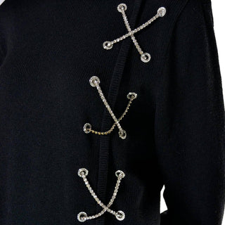Rhinestone X's on a 1980's vintage black knit wool sweater