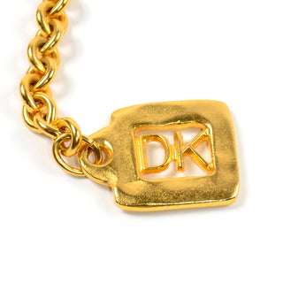 1990s Donna Karan by Robert Lee Morris matte gold DK logo keychain 