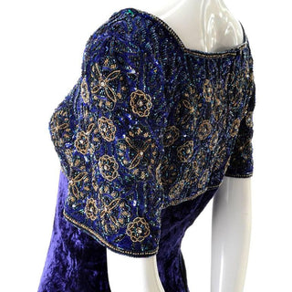 Blue beading and gold sequined bodice of this purple velvet vintage 1990's maxi dress