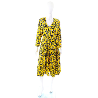 Bright yellow skirt jacket ensemble with graphic road print