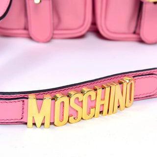 MOSCHINO gold letters on strap of handbag