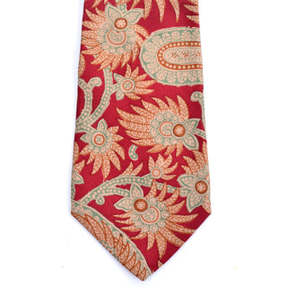 Abstract floral and paisley print on this burgundy silk Pierre Balmain vintage necktie