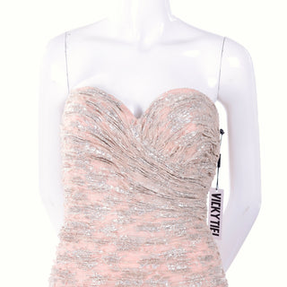 Pale pink and silver ruched strapless evening gown