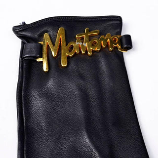 "Montana" gold tone on the wrists of vintage black leather gloves by designer Claude Montana in the 1980's