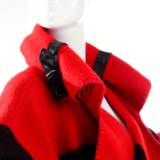 Rolled hood with leather strap blanket coat by Jean Charles de Castelbajac
