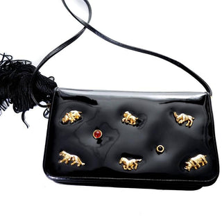 Judith Leiber patent leather handbag with tassel and brass animals