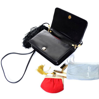 Judith Leiber patent leather bag with tassel and animals. Comes with mirror, comb and coinpurse