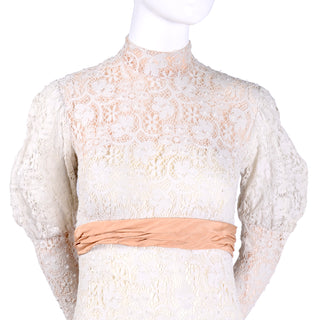 Illusion lace wedding gown with peach sash