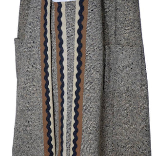 Medium brown tweed cape with zig zag trim 