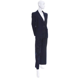 Vintage dark blue pinstripe pantsuit by Yves Saint Laurent. Pant and blazer suit with high waist pants and shoulder pad blazer