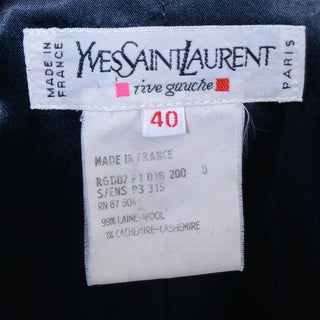 Yves Saint Laurent Rive Gauche label from the 1980's or early 1990's inside a pinstripe navy blue pantsuit